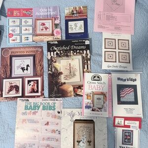 Lot of cross stitching books, patterns, and kits